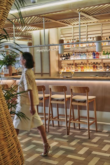 a woman walking in a bar