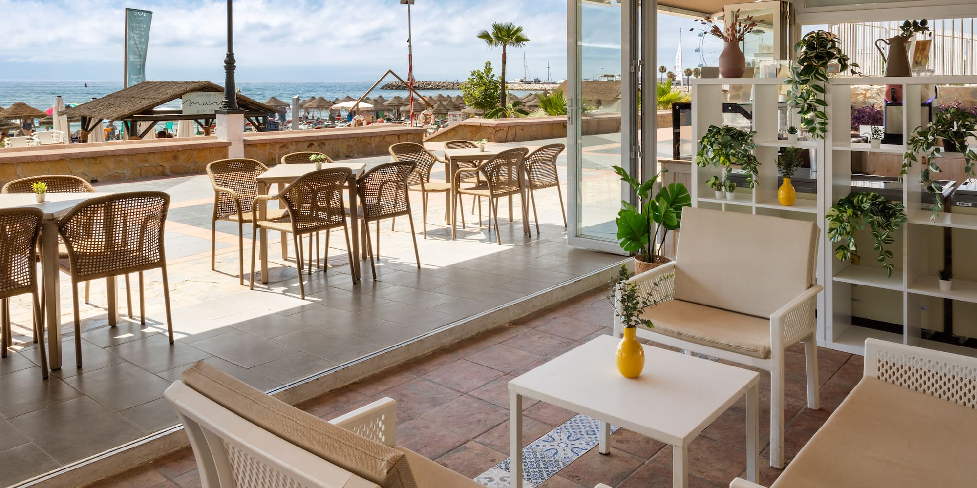 a patio with chairs and tables