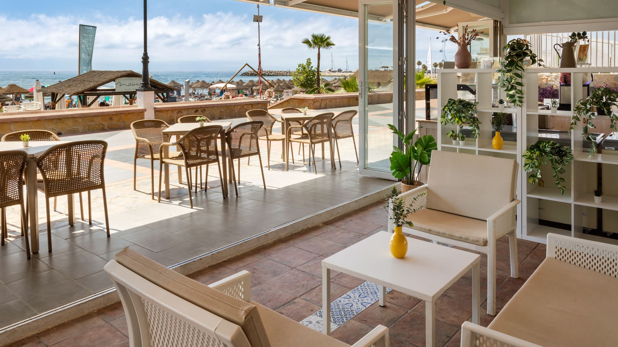 a patio with chairs and tables