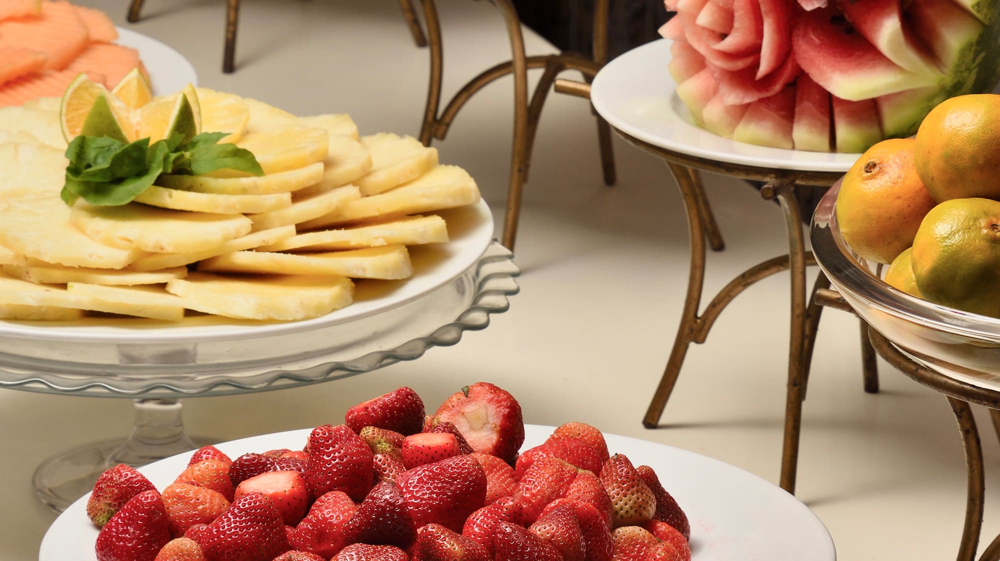 a table with plates of fruit