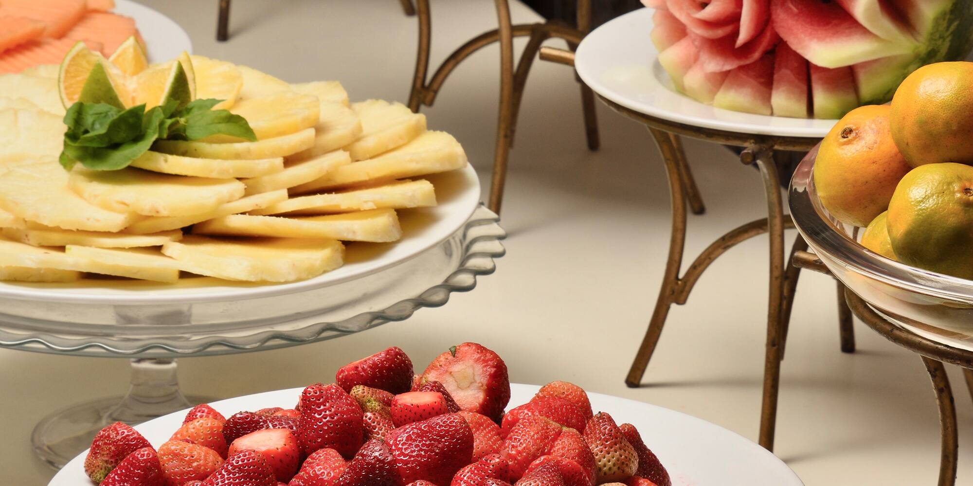 a table with plates of fruit
