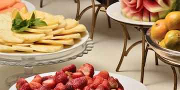 a table with plates of fruit
