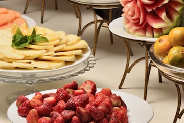 a table with plates of fruit