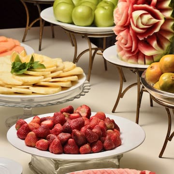 a table with plates of fruit