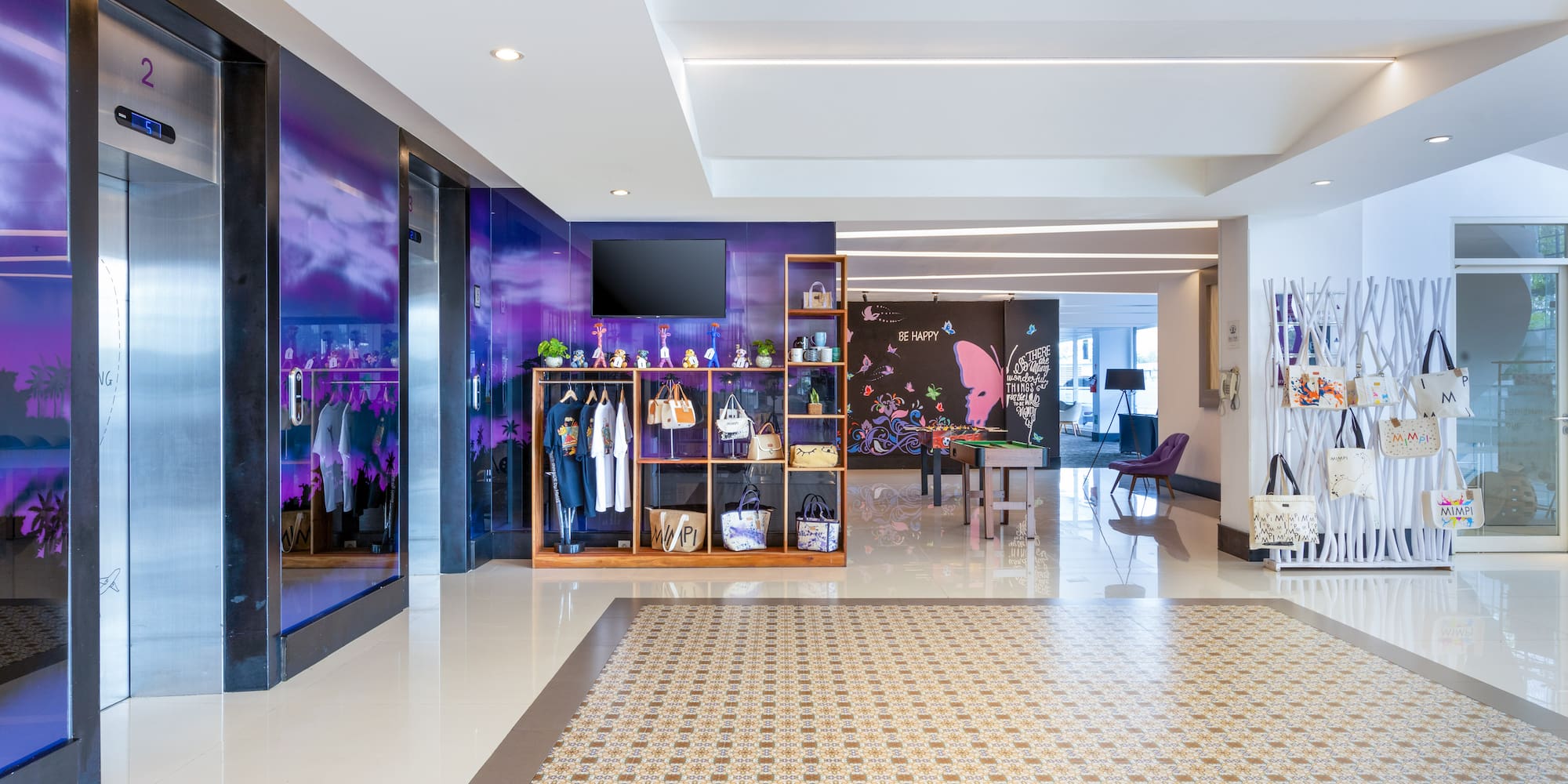 a room with a purple wall and a mirror