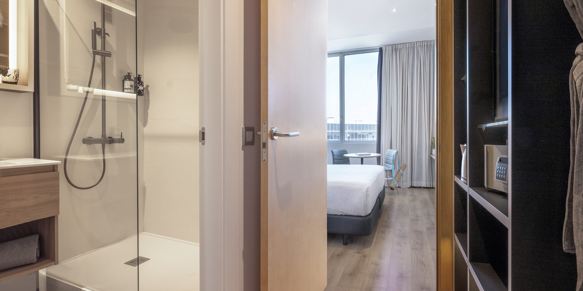 a bathroom with a shower and a bed