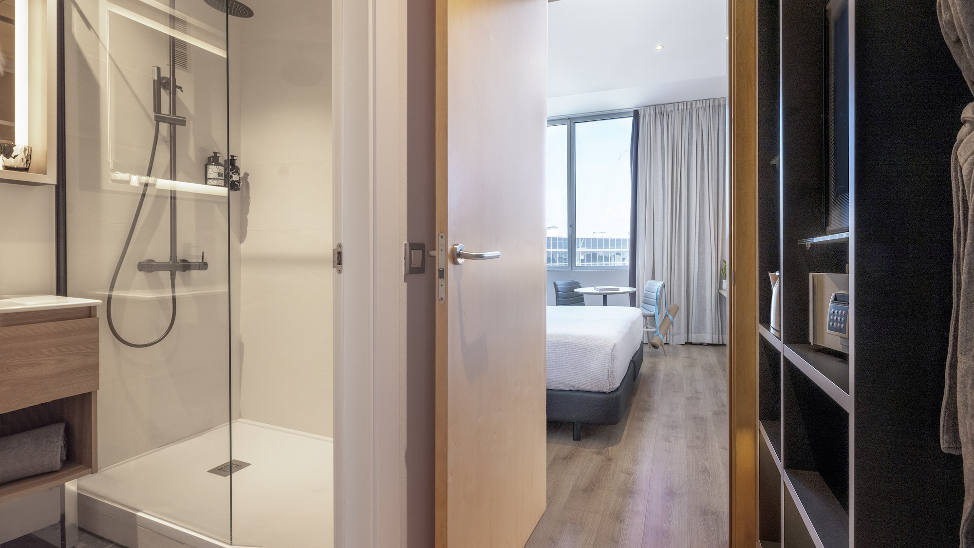 a bathroom with a shower and a bed