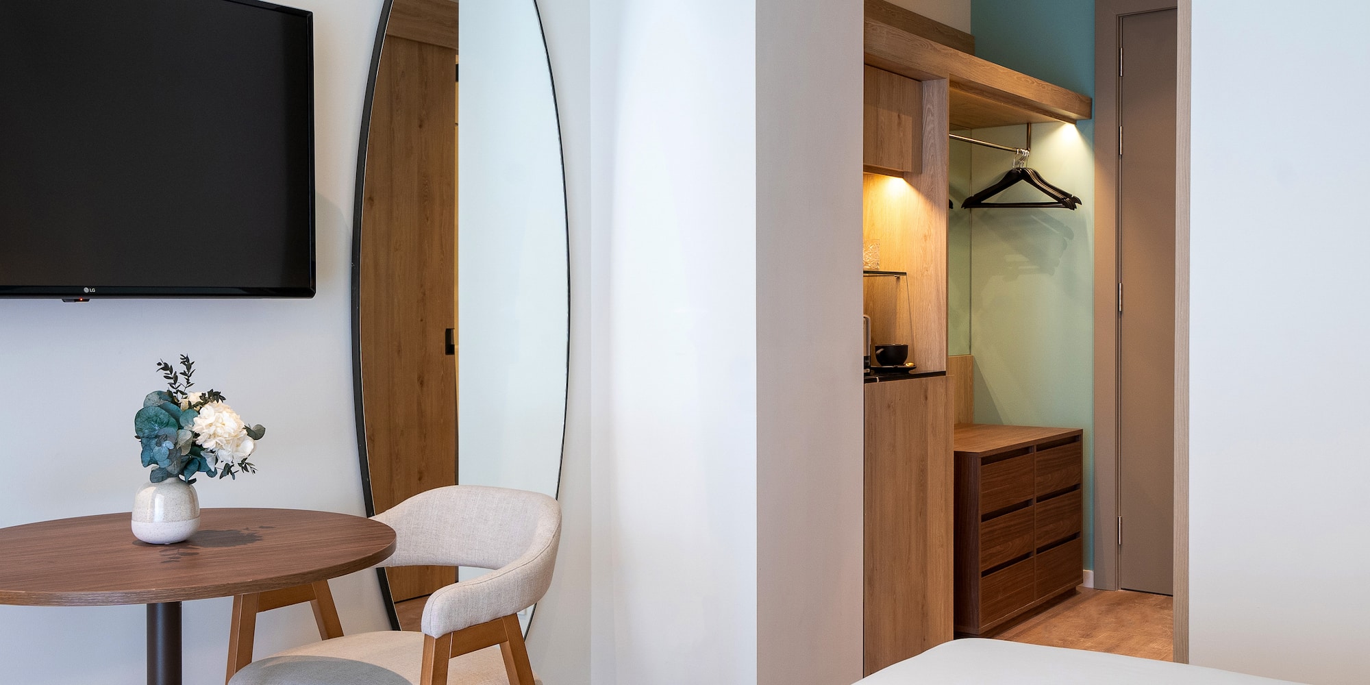 a room with a mirror and a table