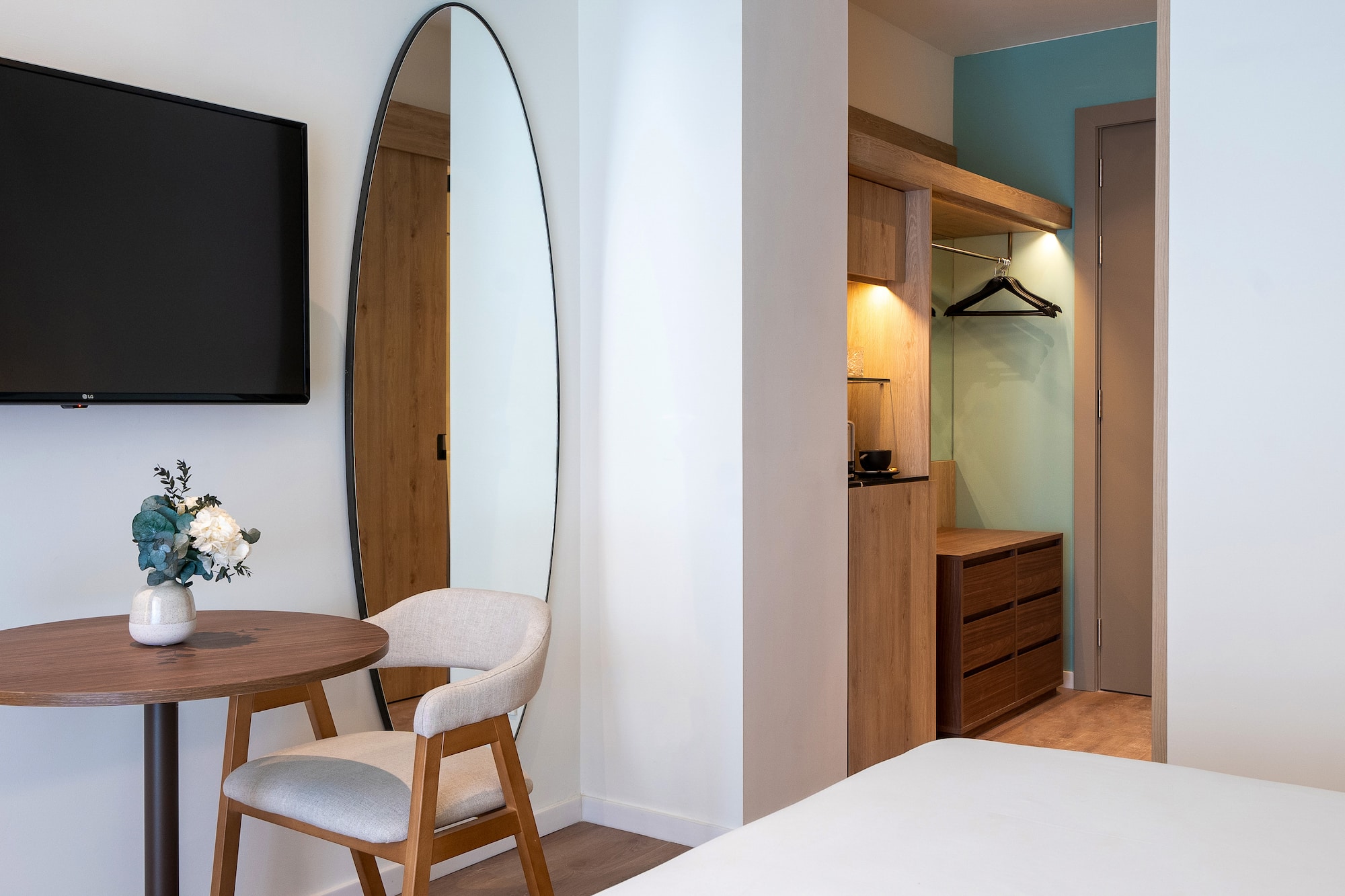 a room with a mirror and a table