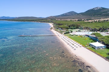 a beach with a dock and a body of water