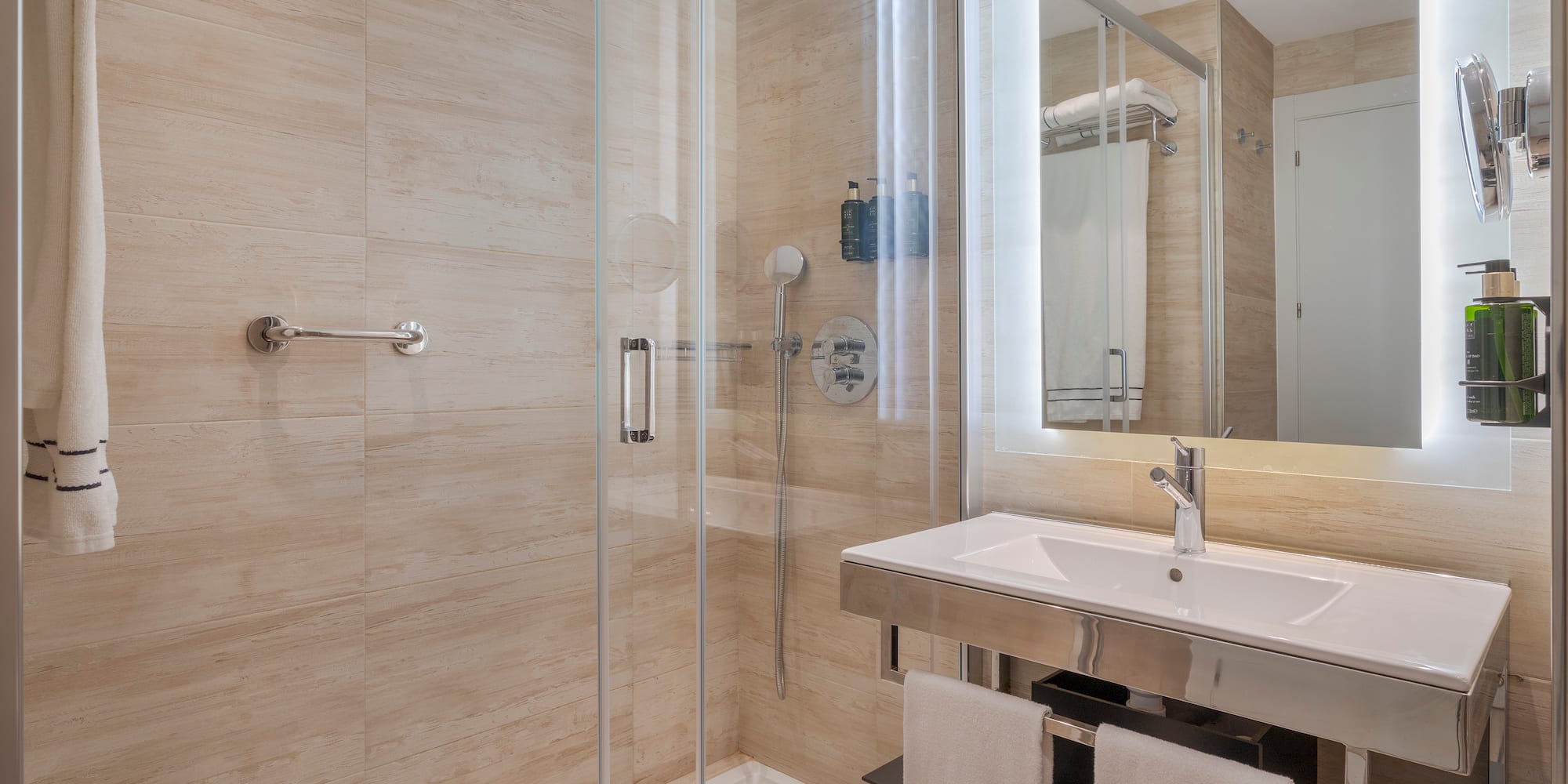 a bathroom with a shower and sink