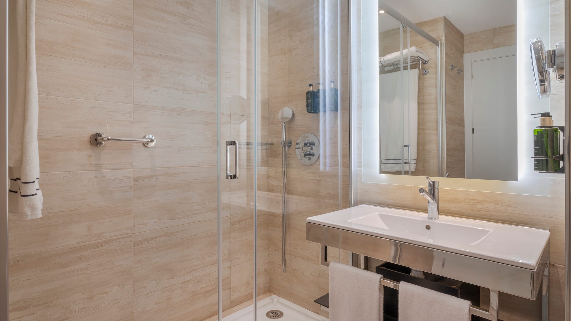 a bathroom with a shower and sink