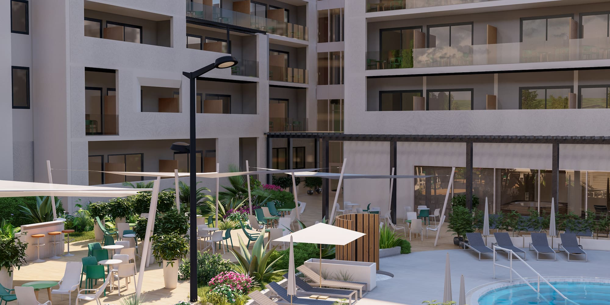 a courtyard with chairs and umbrellas in front of a building