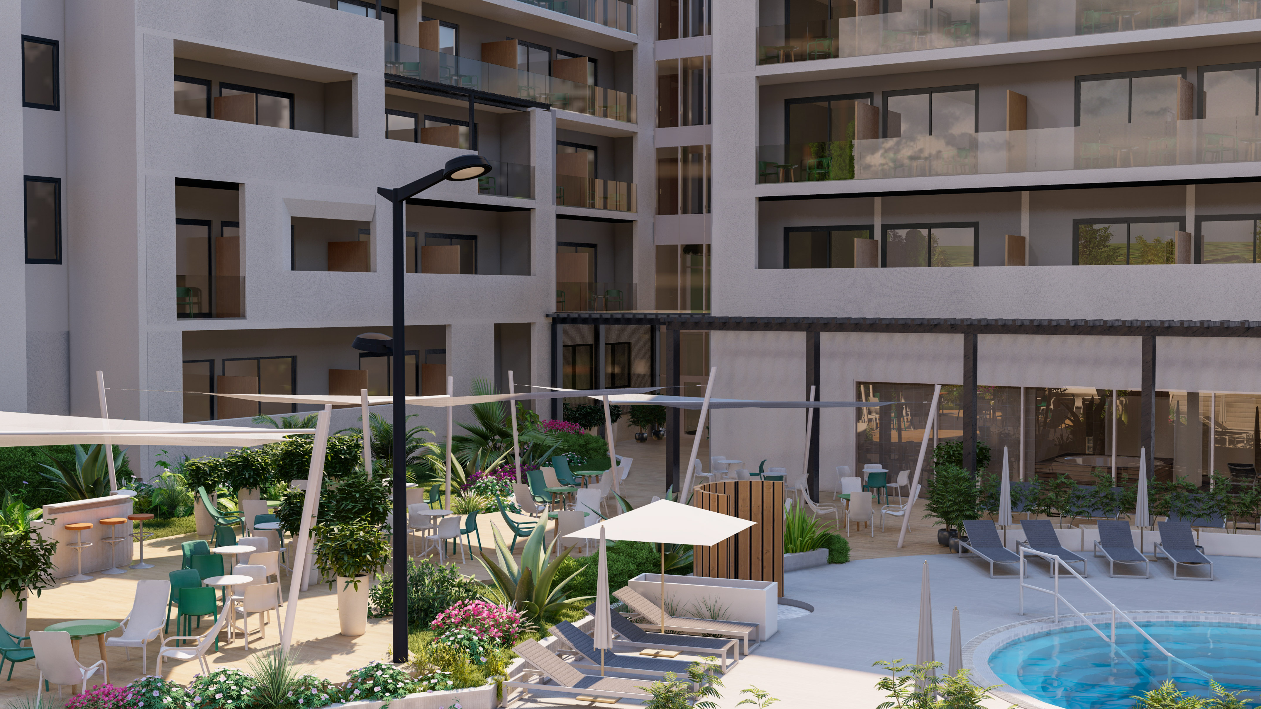 a courtyard with chairs and umbrellas in front of a building