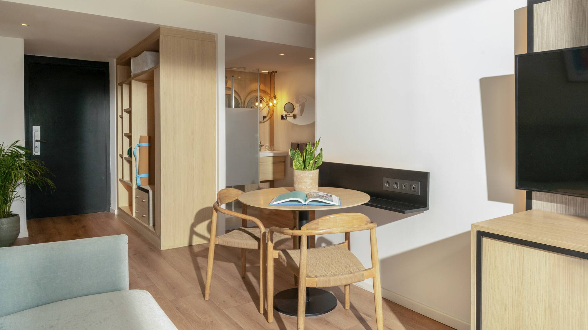 a room with a table and chairs