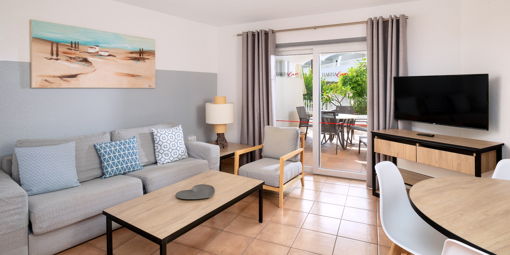 a living room with a television and a couch