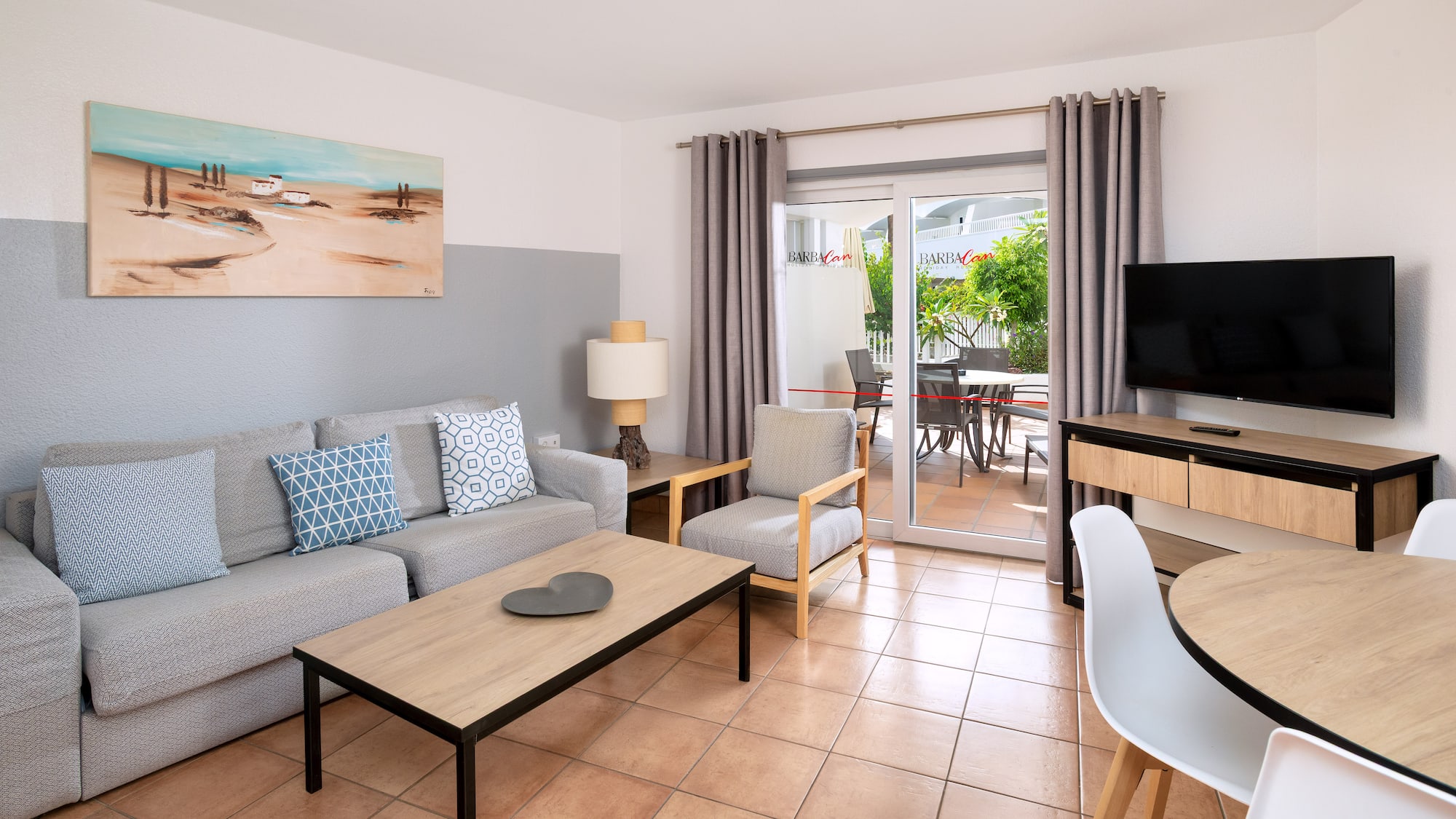 a living room with a television and a couch