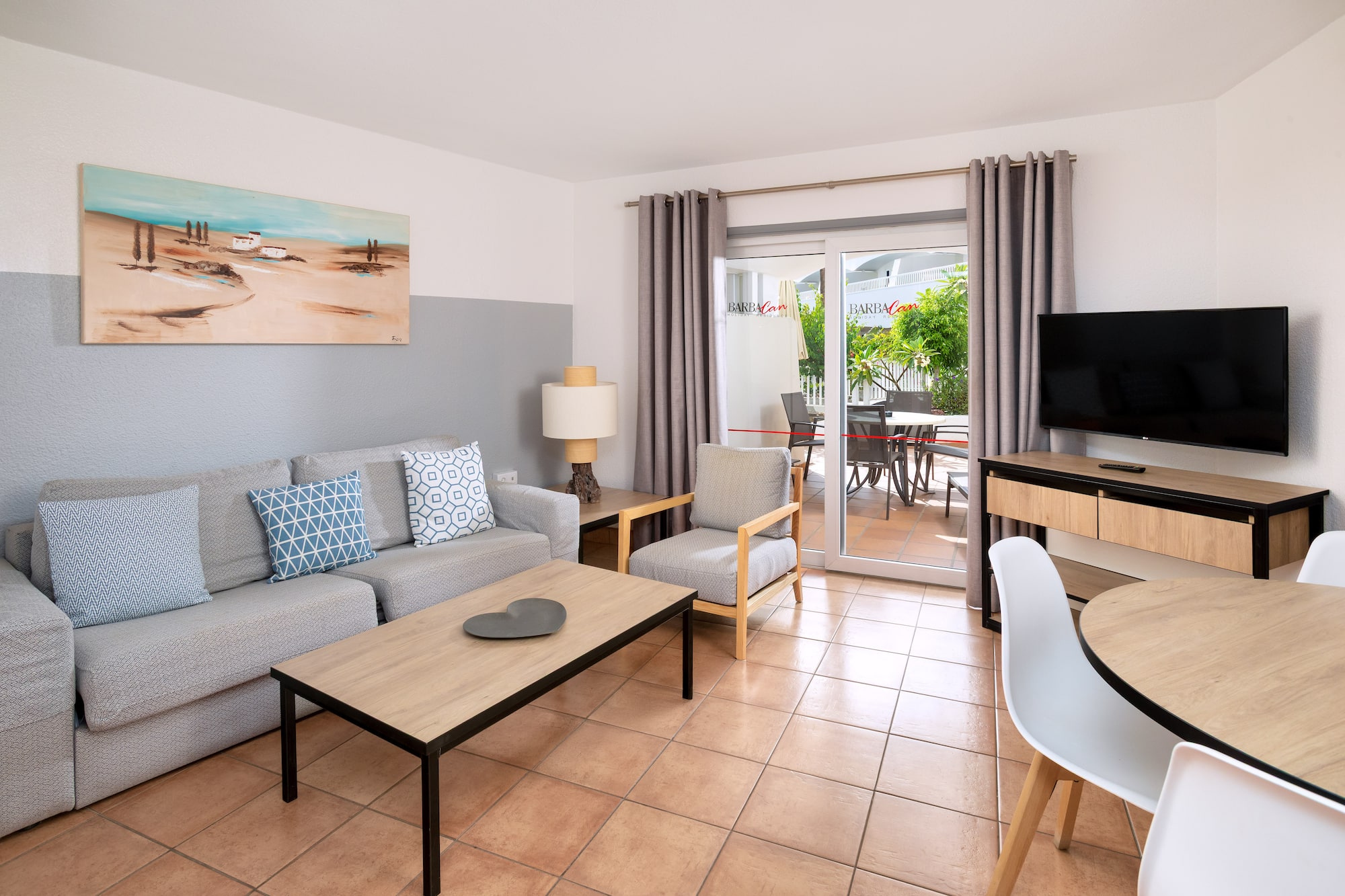 a living room with a television and a couch