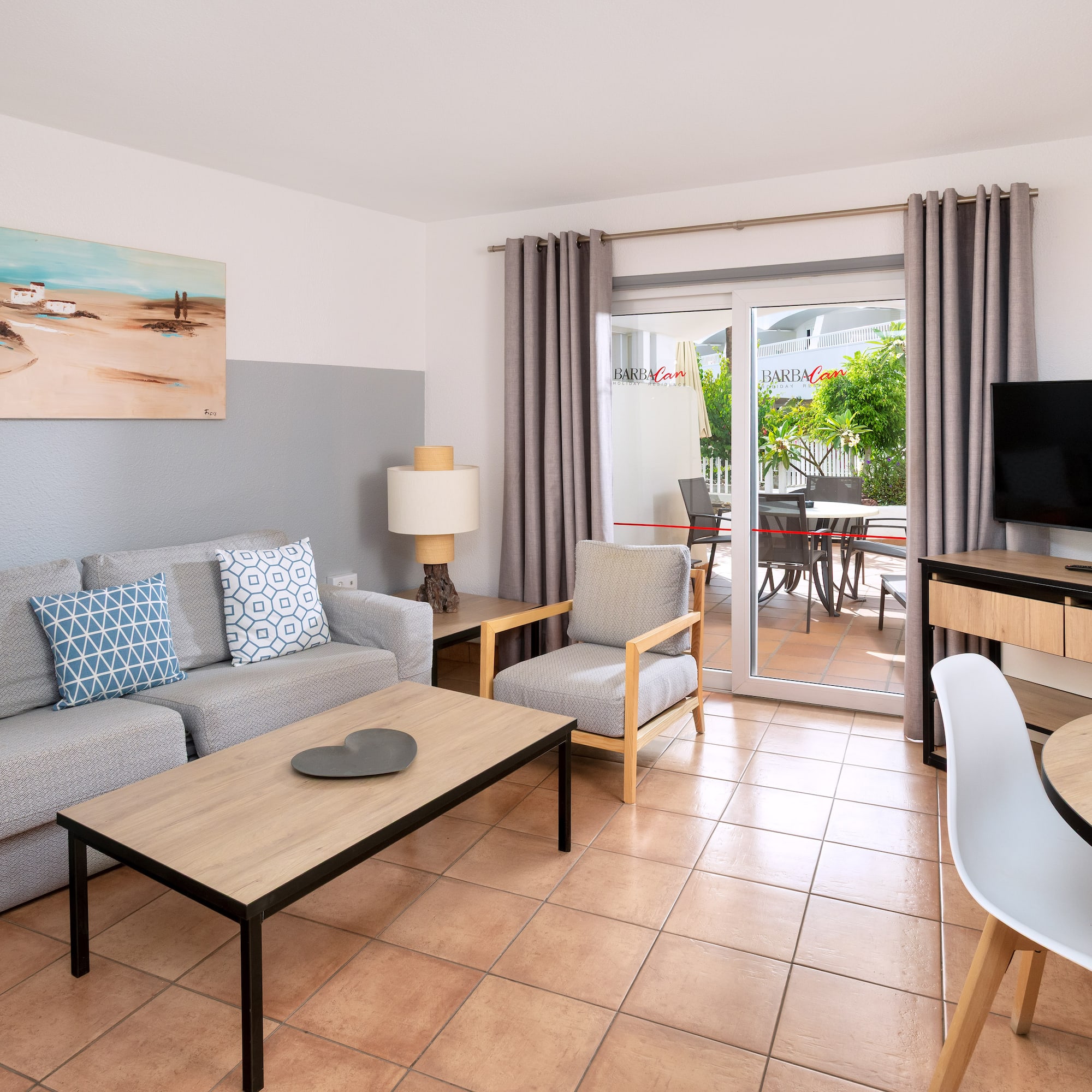 a living room with a television and a couch