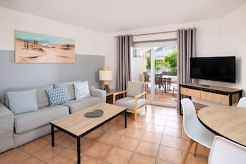 a living room with a television and a couch