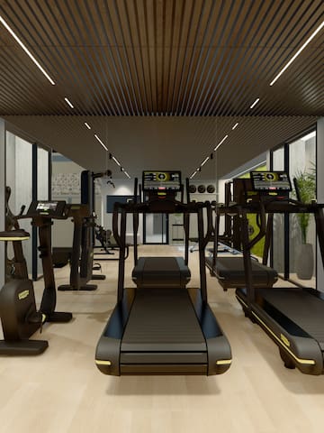 a room with treadmills and exercise equipment