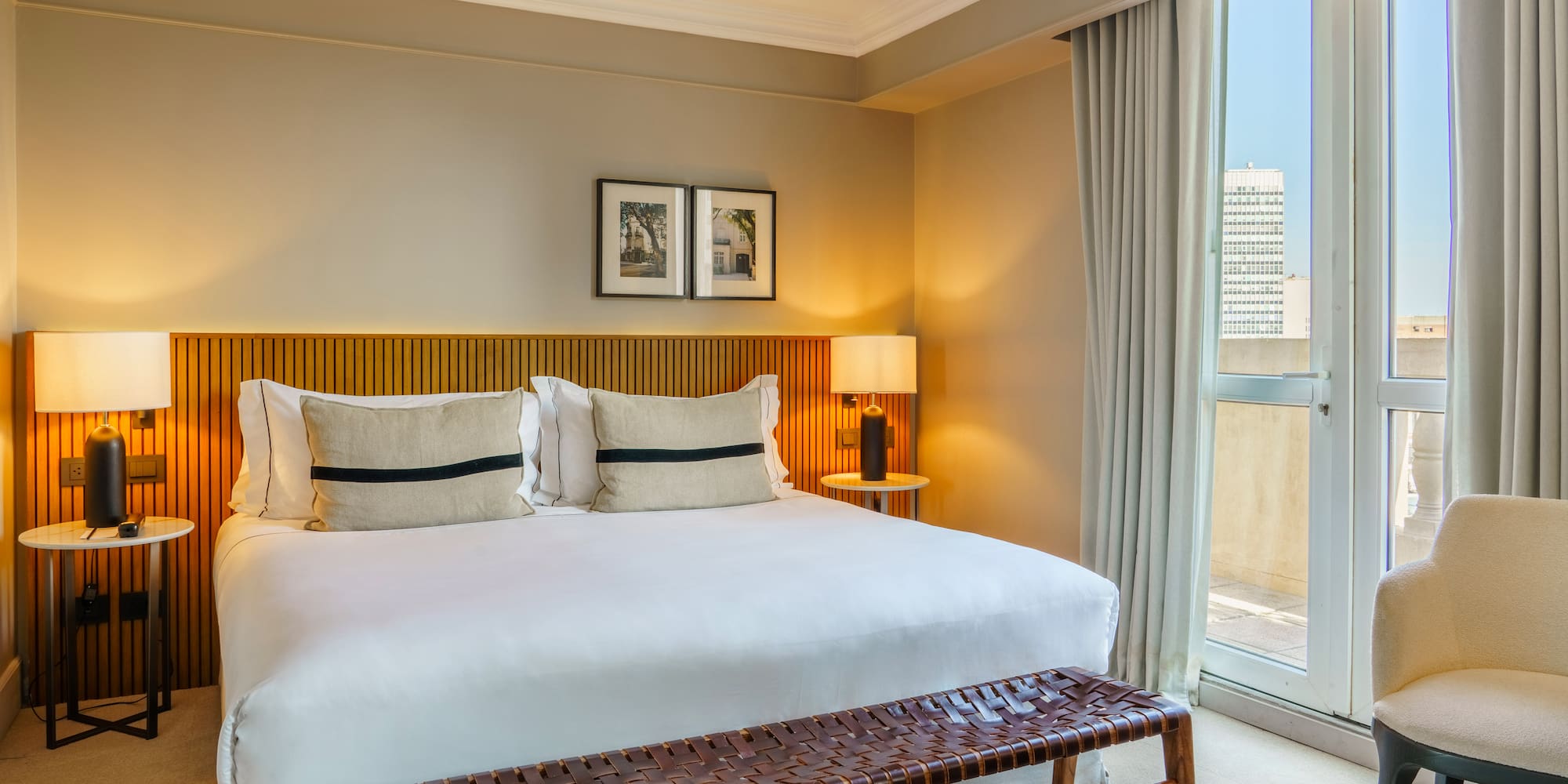 a bed with a bench and a window