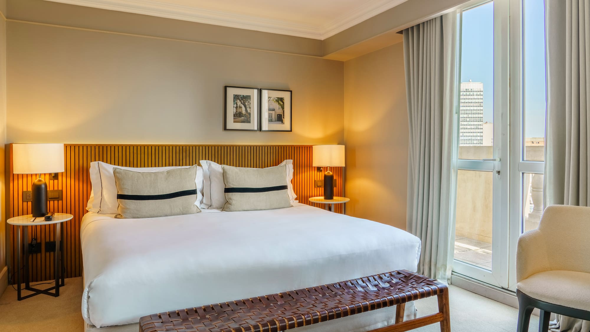 a bed with a bench and a window