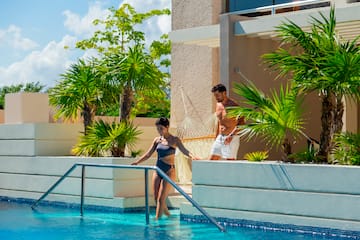 a man and woman in a swimming pool