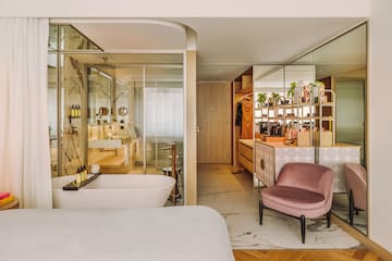 a bathroom with a tub and a bathtub