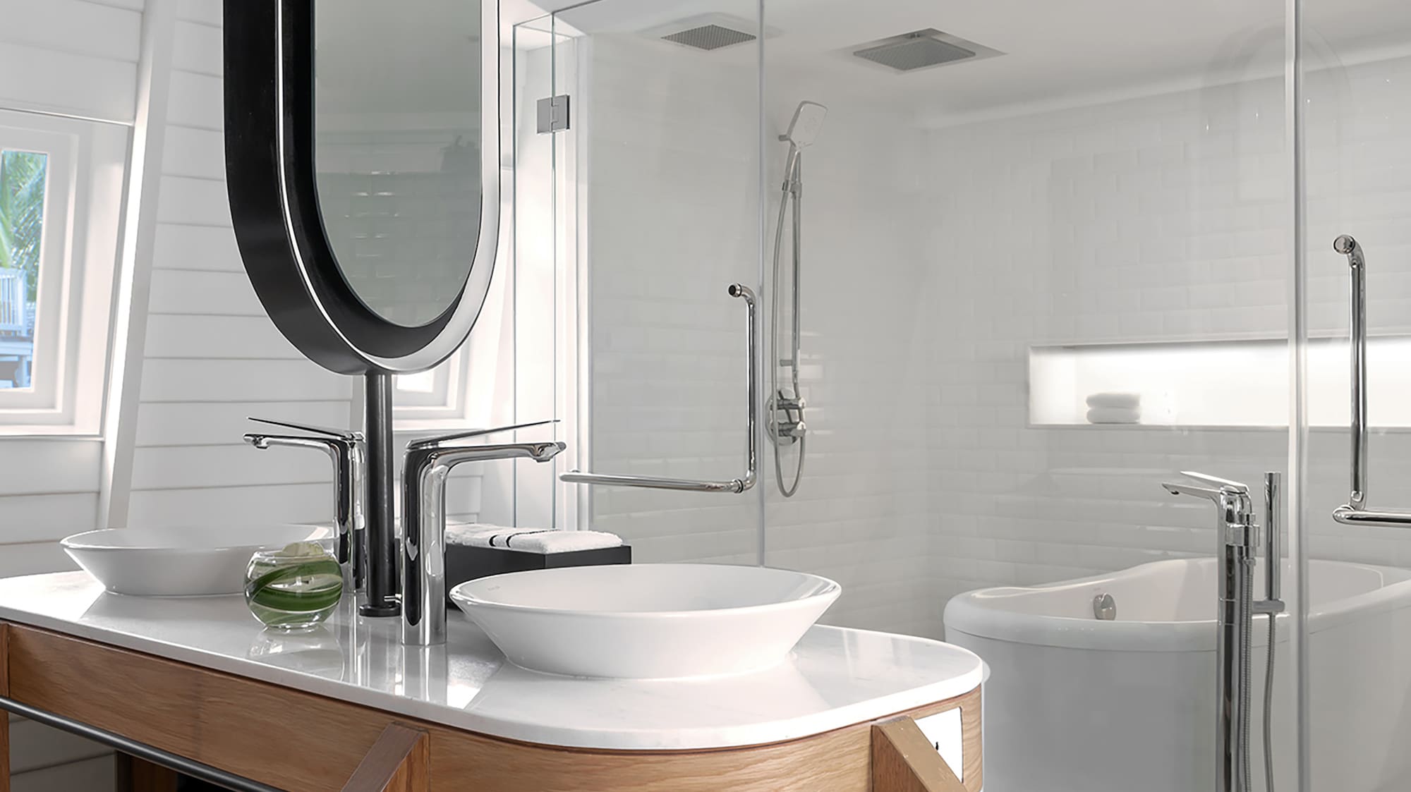 a bathroom with a large mirror and a tub