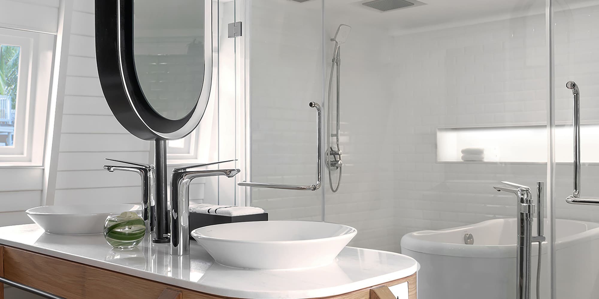 a bathroom with a large mirror and a tub