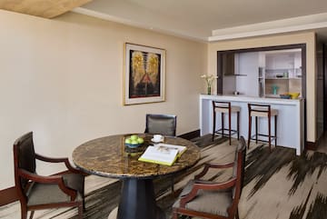 a room with a table and chairs