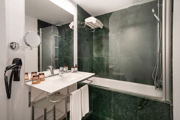 a bathroom with a sink and a shower