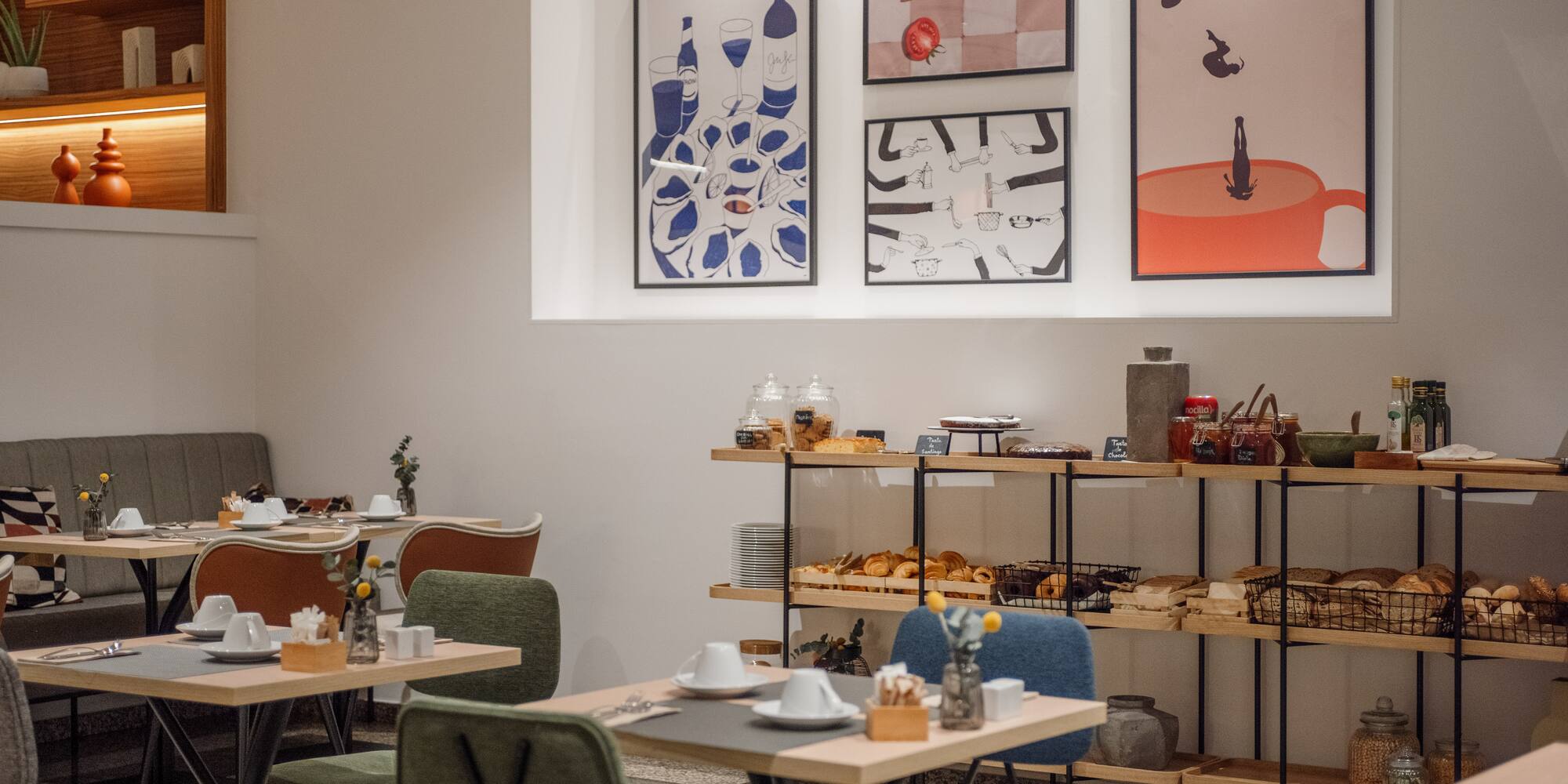 a room with tables and chairs and art on the wall