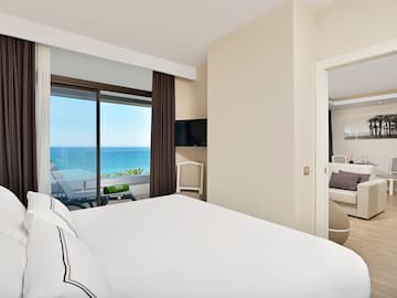 a bedroom with a view of the ocean