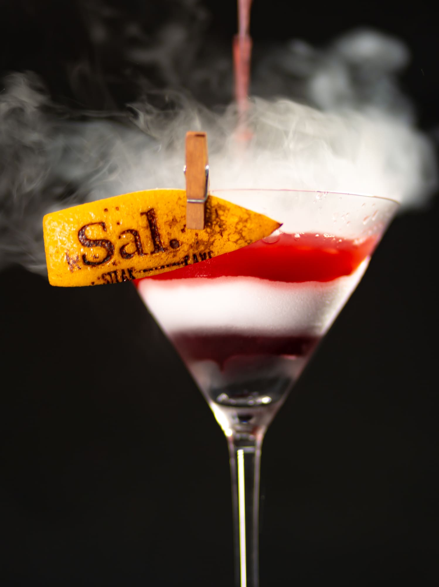 a drink with smoke coming out of it