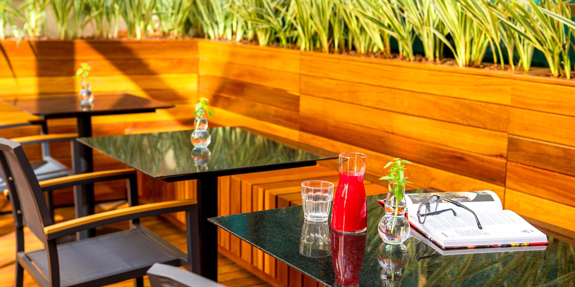 a table with glasses and a book on it