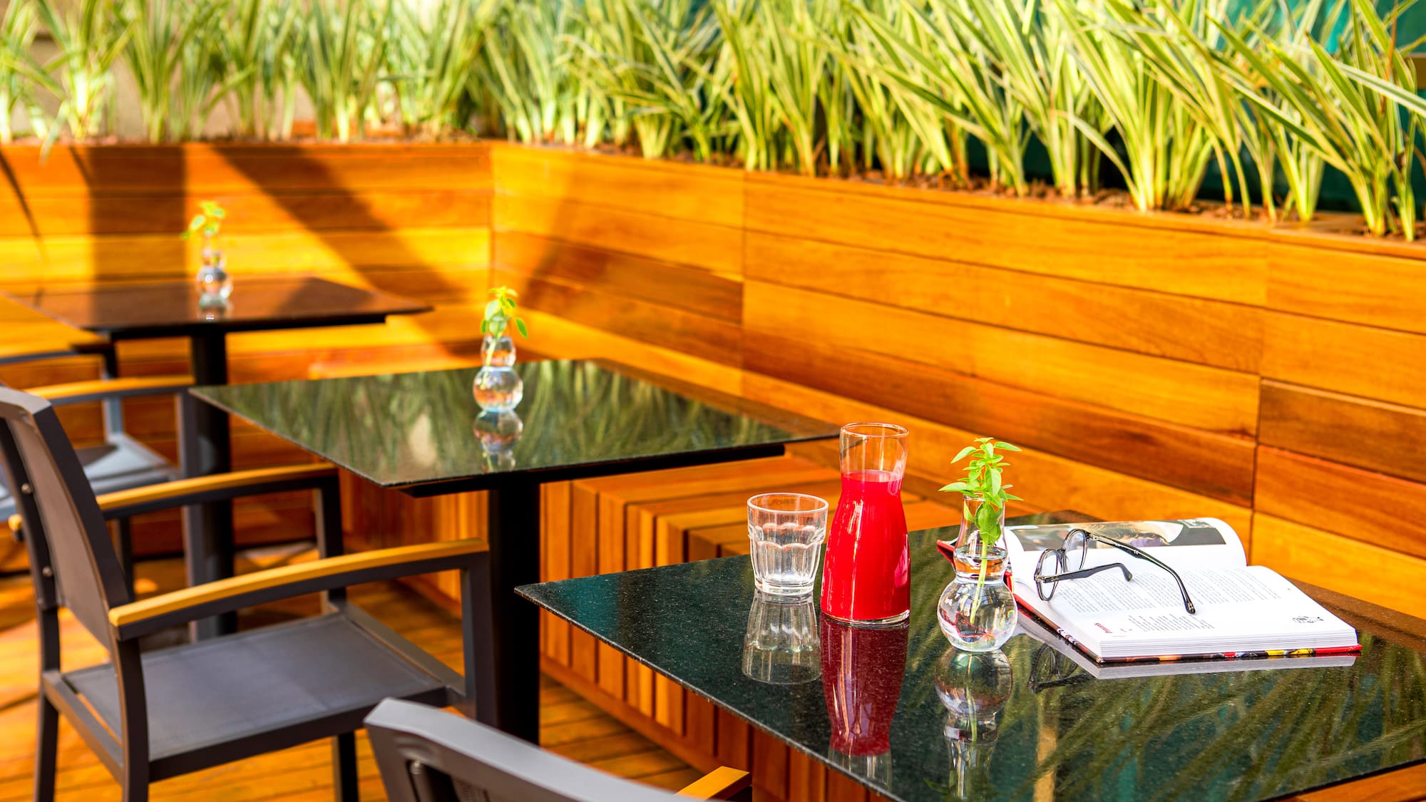 a table with glasses and a book on it