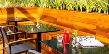 a table with glasses and a book on it