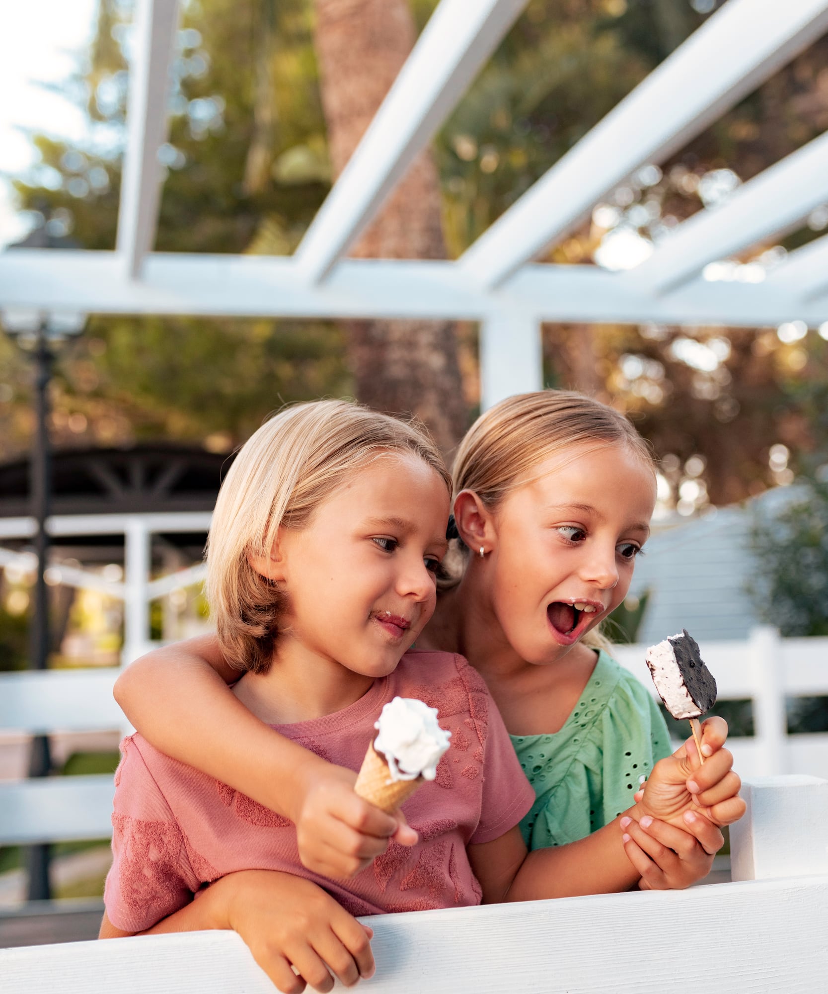 two girls holding ice cream cones