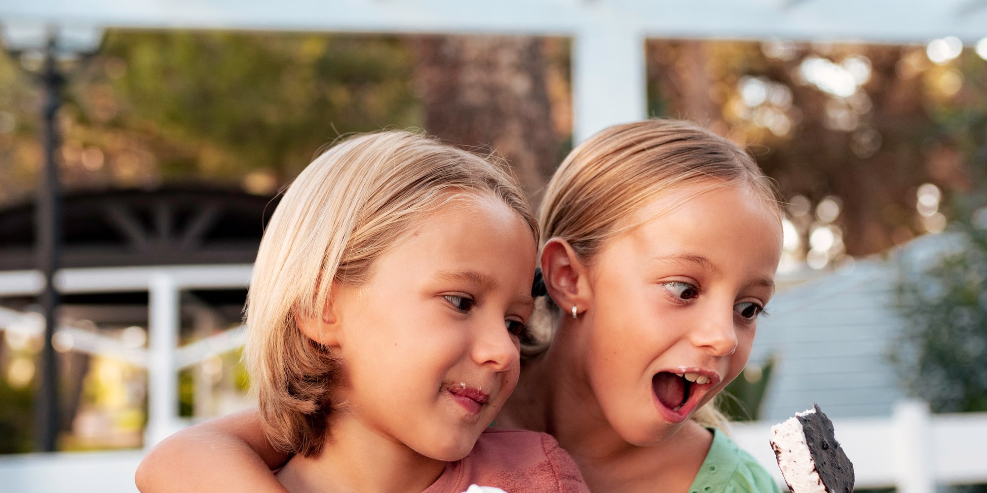 two girls holding ice cream cones