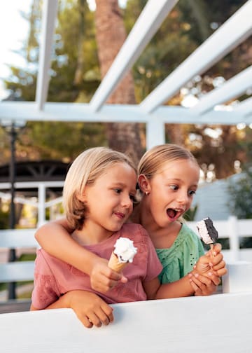 two girls holding ice cream cones