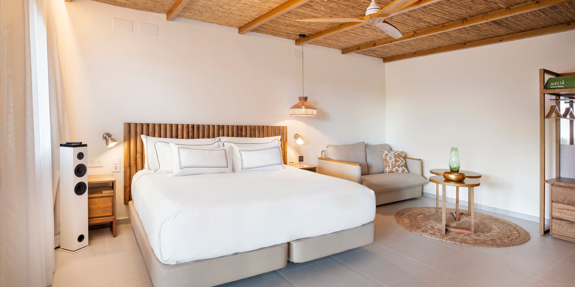 a bedroom with a bed and a couch