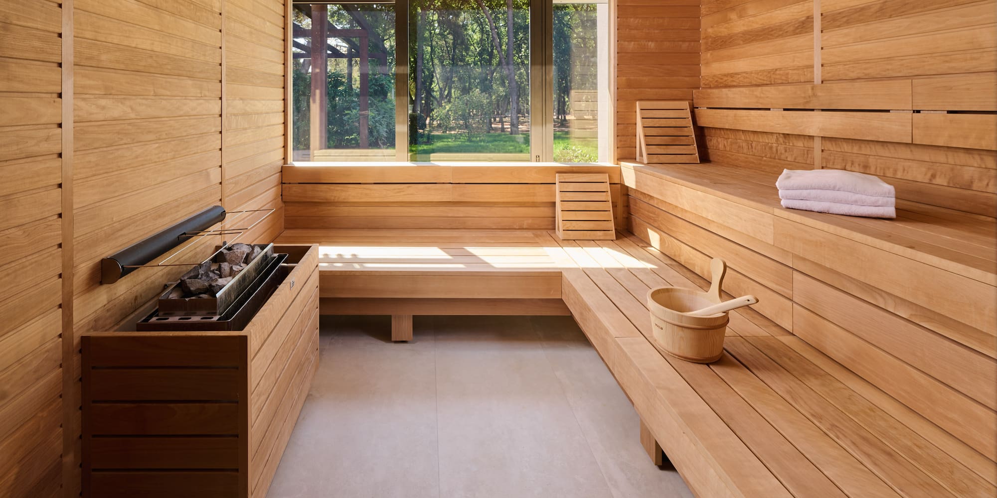 a sauna with a bucket and a fire pit