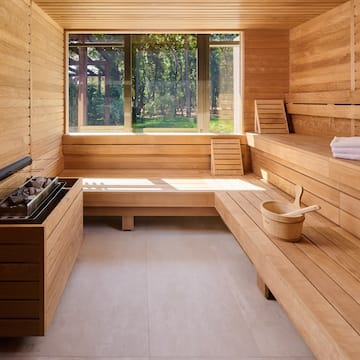 a sauna with a bucket and a fire pit