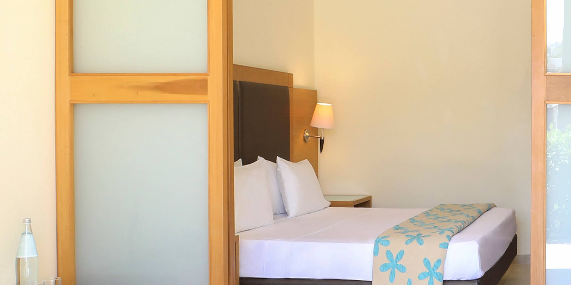 a bedroom with a bed and a table