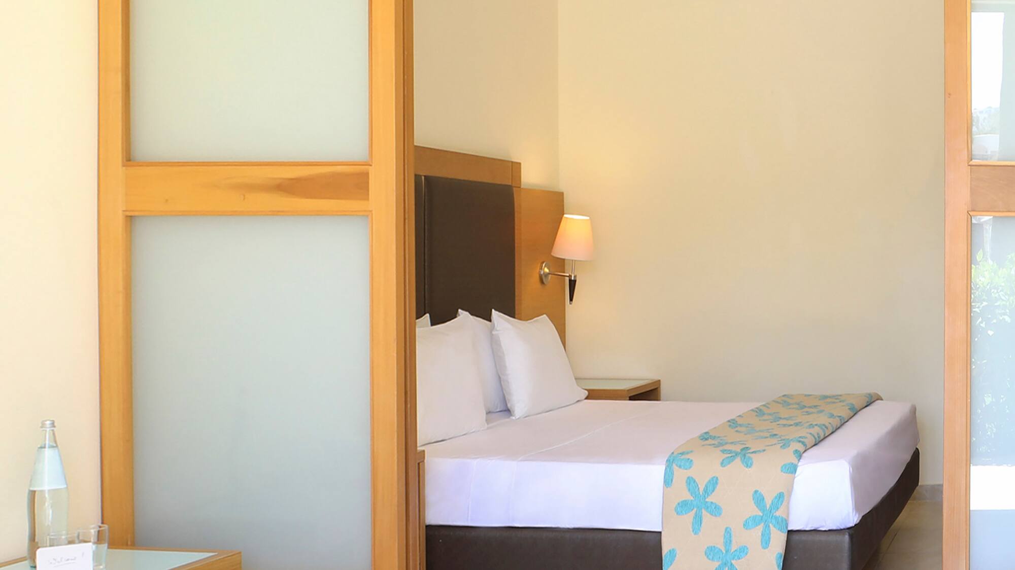 a bedroom with a bed and a table