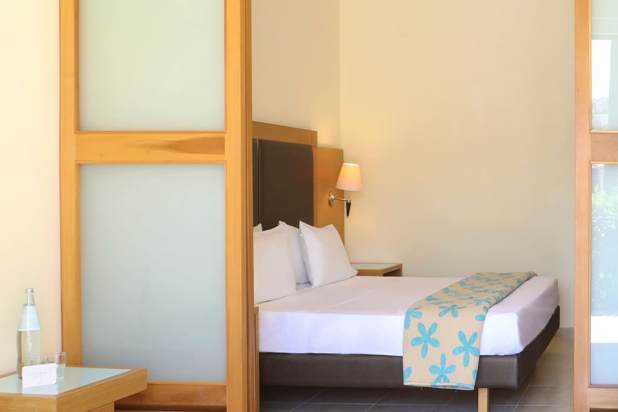 a bedroom with a bed and a table