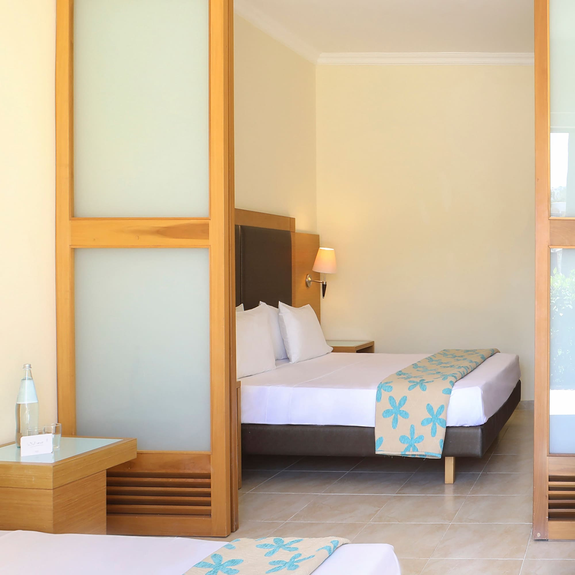 a bedroom with a bed and a table