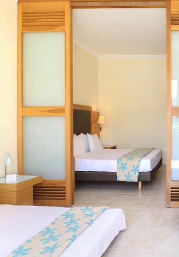 a bedroom with a bed and a table